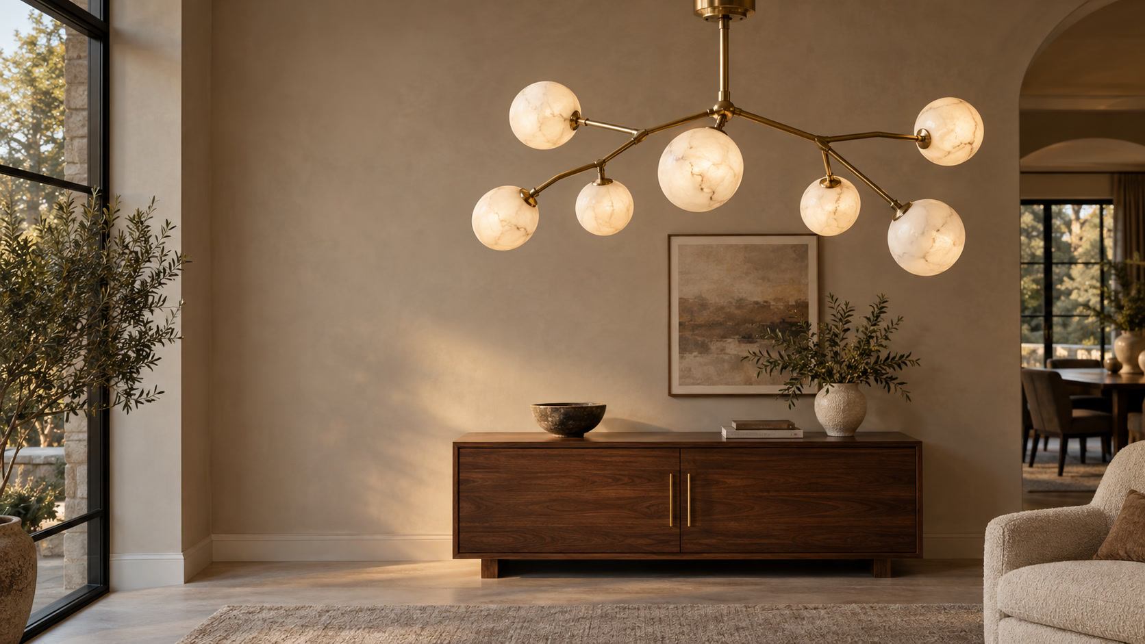 Brass and alabaster branch chandelier above a walnut credenza
